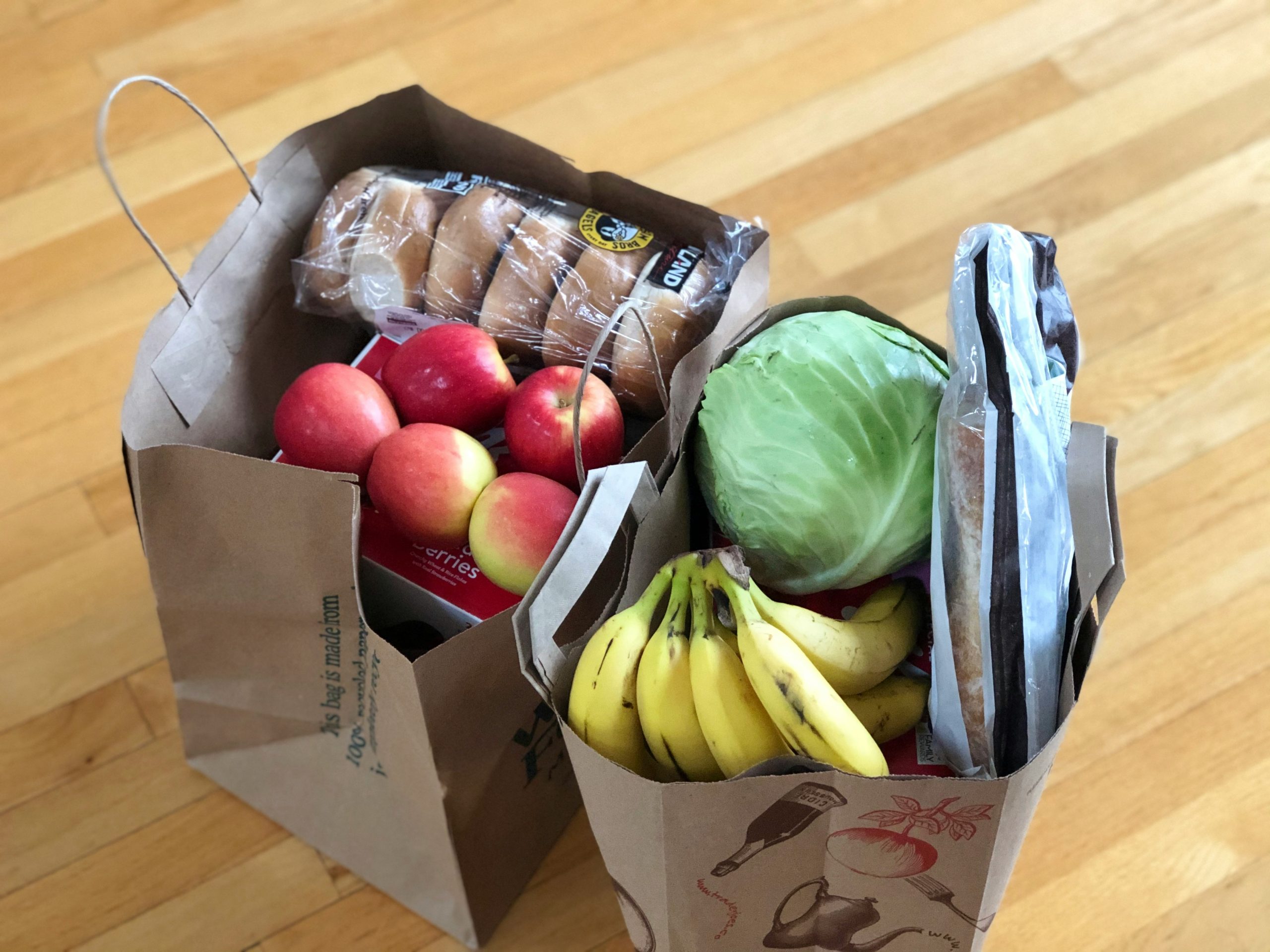 Two paper sacks filled with groceries